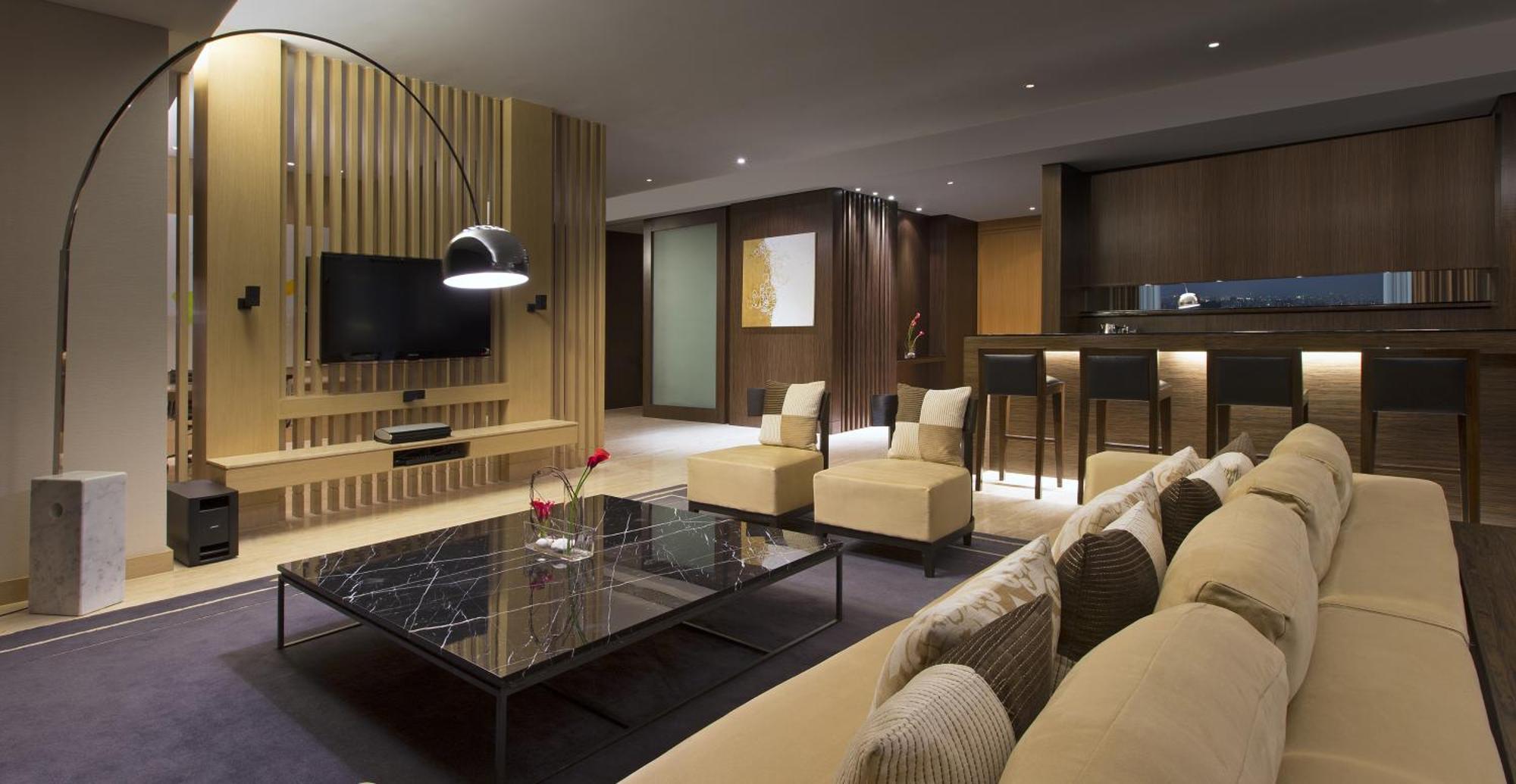 The Westin Mumbai Garden City Exterior photo The living room of a suite at The Ritz-Carlton, Hong Kong